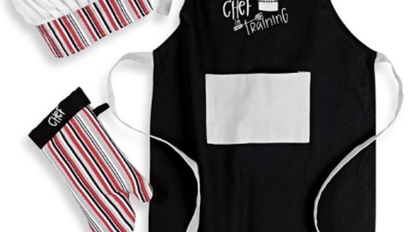 Gift your youngster cooking garb that fits like the Mukitchen Kids Chef in Training 3-Piece Apron Set available at Bed Bath & Beyond.
