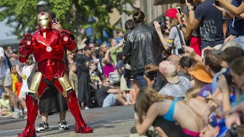 Dressed as Iron Man, Kevin Mathis marches in the annual Dragon Con parade in 2013.