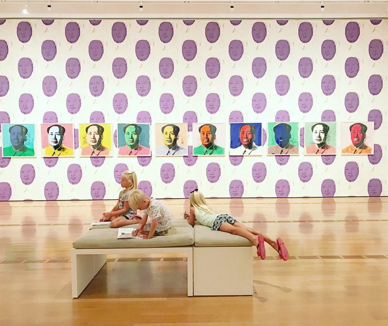 Kirra Loveridge, 6, Brighton Loveridge, 8, and Abel Fitzgerald, 5, take in the sights of the Andy Warhol exhibit at the High Museum on a recent Friday. The cousins enjoyed the made-for-children activities at the museum, like riding on the “Merry Go Zoo” pieces in the High’s courtyard, but they also had a good time with the more “grown-up” displays. CONTRIBUTED BY MEGAN FITZGERALD