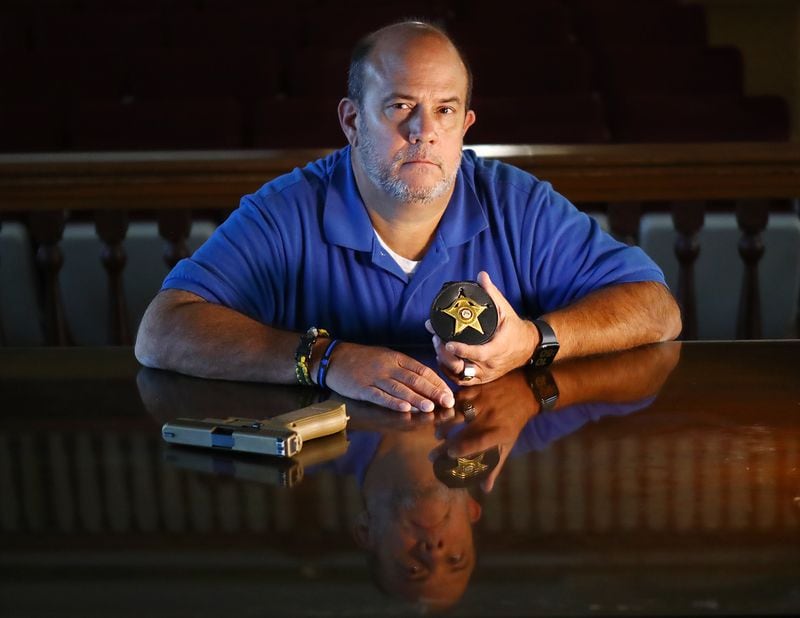 Putnam County Deputy Sgt. John Harper, 56, has done about every job in the agency, from road deputy to detective to head of courthouse security. Harper said the day-to-day stress of the job had started to take a toll on him the past couple years. (Curtis Compton / Curtis.Compton@ajc.com)