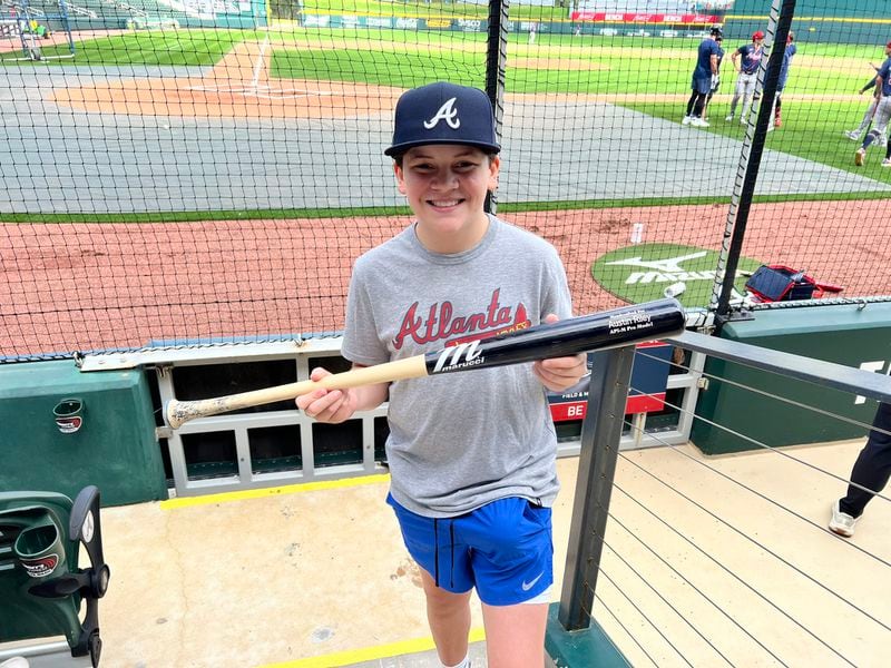 Ryan Patrick was given Austin Riley's bat, delivered by the Braves third baseman, during spring training in North Port, Fla. on Monday, Feb. 19, 2024.