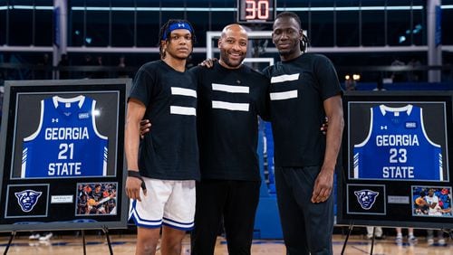 Kalik Brooks (L) and Joe Jones III (R), with coach Jonas Hayes, were honored at Senior Night on Feb. 22, 2023 at the GSU Convocation Center.
