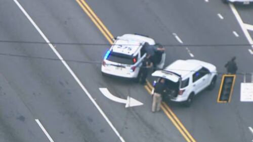 The officer-involved shooting happened on Jimmy Carter Boulevard near Peachtree Industrial Boulevard.