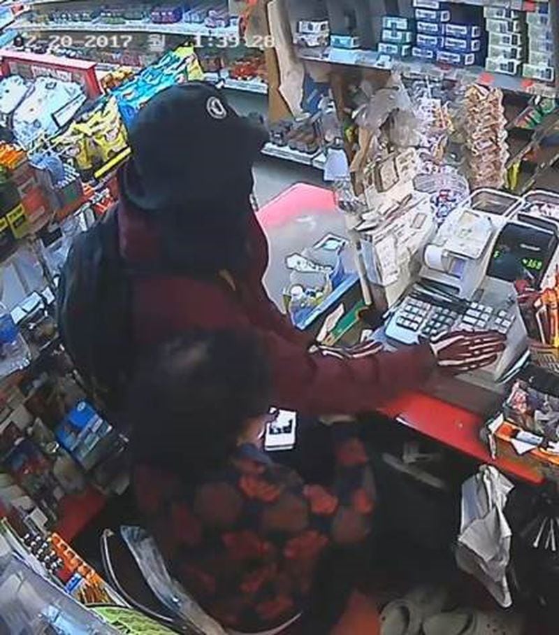 One accomplice held employees and customers at gunpoint while another suspect grabbed money from the register. (Credit: Atlanta Police Department)