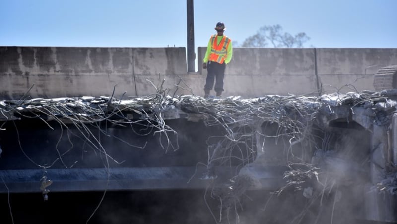 Necessary work is continuing on the damaged sections of I-85 bridge structures on April 1, 2017. This includes demolition of the existing failed and damaged structures. HYOSUB SHIN / HSHIN@AJC.COM