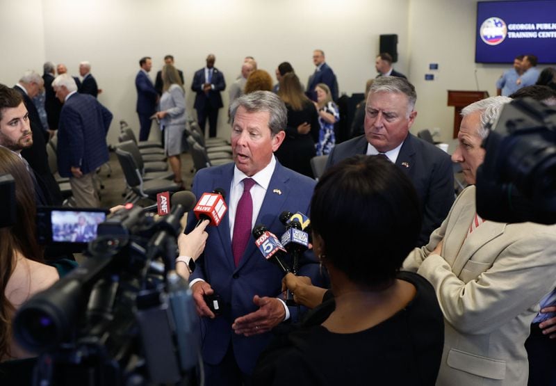 Gov. Brian Kemp speaks to the media after signing multiple bills at the Georgia Public Training Center in Forsyth, Ga. on Wednesday, May 1, 2024. (Natrice Miller/ AJC)
