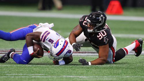 Falcons defensive end Derrick Shelby sacks Bills quarterback Tyrod Taylor during the first half in a NFL football game on Sunday, October 1, 2017, in Atlanta.   Curtis Compton/ccompton@ajc.com