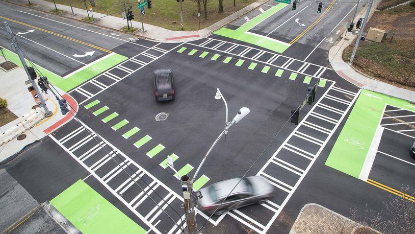 The intersection of Commerce Drive and West Trinity Place in downtown Decatur, Thursday, January 23, 2020. The city renovated the sidewalks adding enough space for a bicycle lane in addition to foot traffic. (ALYSSA POINTER/ALYSSA.POINTER@AJC.COM)