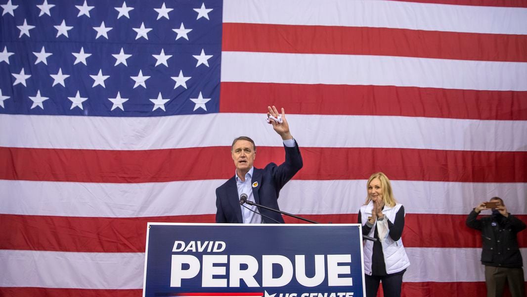 Republican Senator from Georgia David Perdue (L) and his wife Bonnie participate in a rally at DeKalb-Peachtree Airport during the first day of early voting in US Senate runoff election in Atlanta, Georgia, USA, 14 December 2020. Perdue is running against Democrat Jon Ossoff in a 05 January 2021 runoff election.