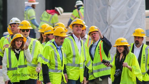 Sen. David Perdue (center) and Georgia Department of Transportation Commissioner Russell McMurry toured the site of the I-85 bridge collapse Wednesday. JOHNS SPINK/AJC