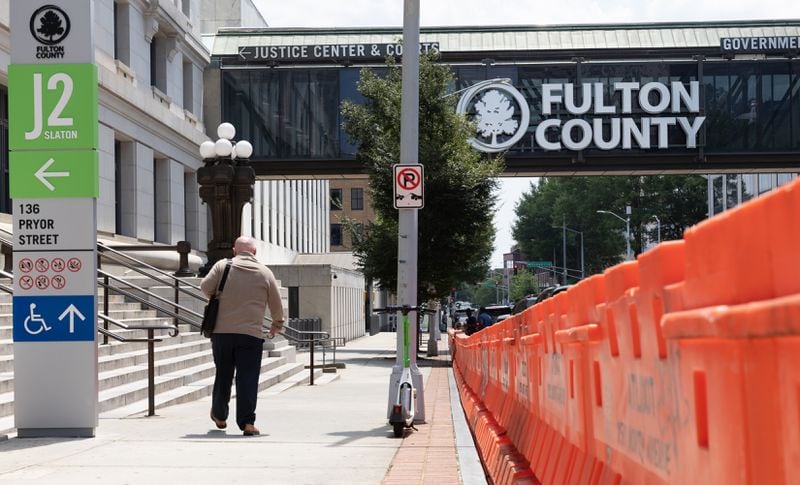 Barricades are seen in front of Fulton County Courthouse in Atlanta on Thursday, July 27, 2023. (Arvin Temkar / arvin.temkar@ajc.com)