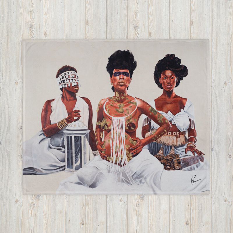 A throw blanket featuring stylized Black women can be used in the home as for warmth or art.
Courtesy of Computer generated handout from Dr. Fahamu Pecou's team