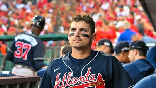 Braves third baseman Austin Riley looks on from the dugout as the Phillies celebrate their series-clinching victory after Game 4 of the National League Division Series on Oct. 15 at Citizens Bank Park. (Hyosub Shin / Hyosub.Shin@ajc.com)