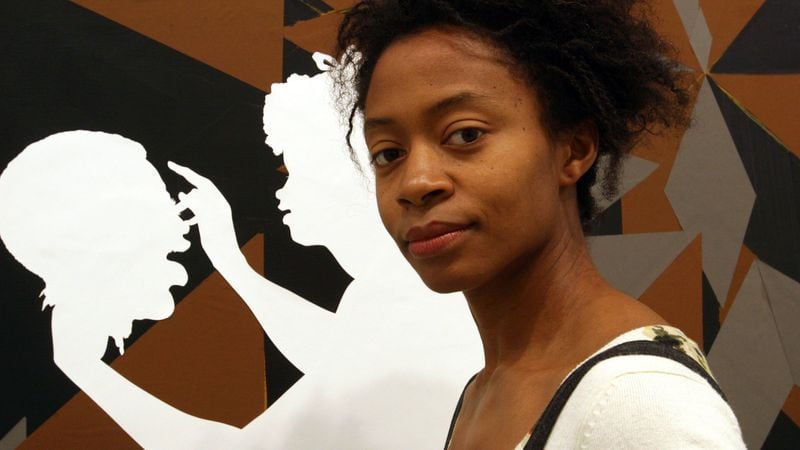 Kara Walker, who received her Bachelor of Fine Arts from the Atlanta College of Art, is a mural artist known for her large-scale cut-paper silhouette works. TINA FINEBERG / ASSOCIATED PRESS
