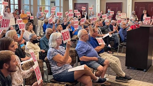 More than 50 residents packed into Tuesday's meeting of Suwanee City Council to protest a proposed zoning amendment. (Tyler Wilkins / tyler.wilkins@ajc.com)