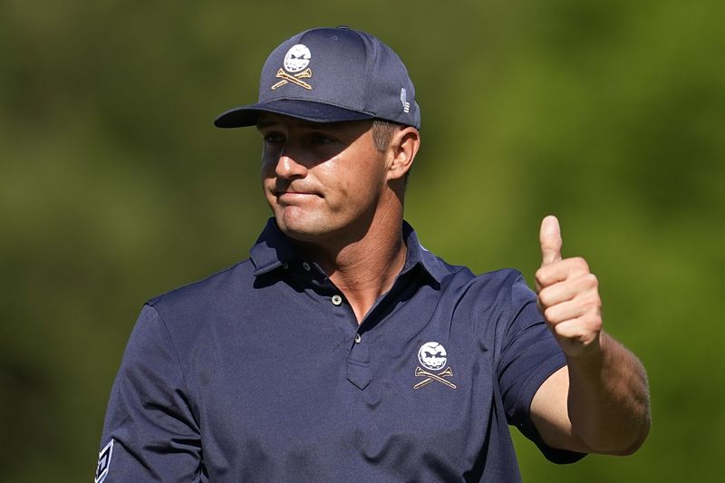 Bryson DeChambeau gestures after finishing the 12th hole during final round at the Masters golf tournament at Augusta National Golf Club Sunday, April 14, 2024, in Augusta, Ga. (AP Photo/George Walker IV)