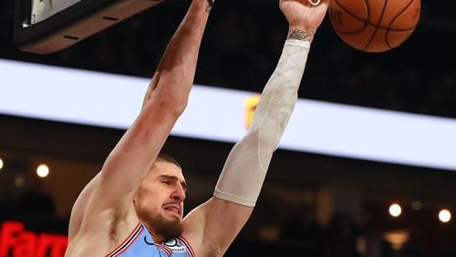 Atlanta Hawks center Alex Len slams for two against the Oklahoma City Thunder during the first half in a NBA basketball game on Tuesday, Jan. 15, 2019, at State Farm Arena in Atlanta.    Curtis Compton/ccompton@ajc.com