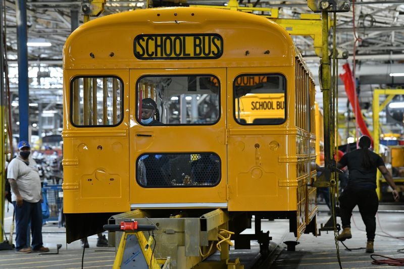 Workers assemble a school bus at a Blue Bird manufacturing facility in Fort Valley on Tuesday, May 4, 2021. (Hyosub Shin / Hyosub.Shin@ajc.com)