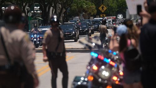 A motorcade of vehicles, with former US President Donald Trump on board, arrives at Wilkie D. Ferguson Jr. United States Federal Courthouse in Miami, Florida, on June 13, 2023. Trump is appearing in court in Miami for an arraignment regarding 37 federal charges, including violations of the Espionage Act, making false statements and conspiracy regarding his mishandling of classified material after leaving office. (Ricardo Arduengo/AFP via Getty Images/TNS)