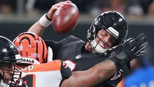 Falcons quarterback Matt Ryan draws the penalty as Bengals defensive tackle Josh Tupou is called for roughing the passer during the third quarter Sunday, Sept. 30, 2018, at Mercedes-Benz Stadium in Atlanta.