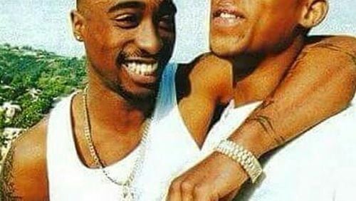 “Rest in Paradise,” The Outlawz wrote in a Sunday Twitter post that featured a photo of Hussein Fatal (left) with Tupac Shakur. (Credit: Twitter)