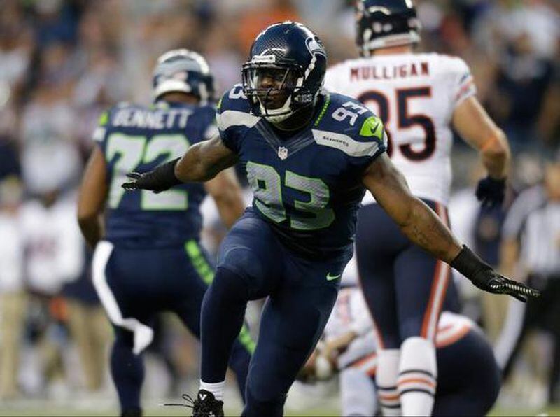 Former Seahawks defensive end O’Brien Schofield here celebrating a sack against the Bears in 2014. Schofield nearly signed with the Giants, last offseason but failed a physical. He's listed as an outside linebacker by the Falcons. JOHN FROSCHAUER — The Associated Press