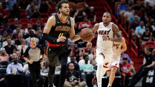 Atlanta Hawks guard R.J. Hunter (4) dribbles during an exhibition NBA game against the Miami Heat, Friday, Oct. 12, 2018, in Miami. (AP Photo/Lynne Sladky)
