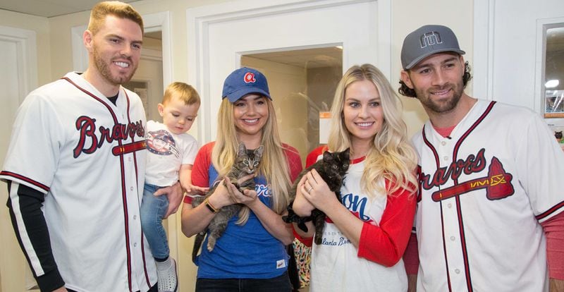 (Left to right) Atlanta Braves baseball player Freddie Freeman poses with his son Charlie (age 2), wife Chelsea, Sarah and Charlie Culberson during a visit to Best Friends in Atlanta as part of the team's Season of Giving on Wednesday, Dec. 12, 2018. The animal shelter works collaboratively with area shelters, animal welfare organizations and individuals to save the lives of pets in shelters in the South. (Photo by Phil Skinner)