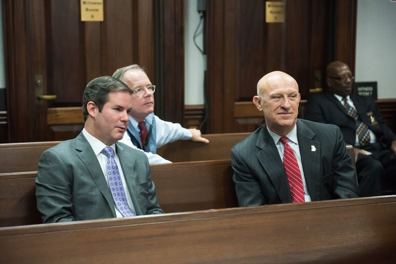 Lead prosecutor Chuck Boring, left, and Cobb County District Attorney Vic Reynolds sit in the gallery as evidence is prepared to send to the jurors for their deliberations last week. (John Carrington / for the AJC)