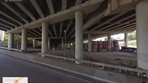 This image from Google Maps Street View shows the spools of high-density polyethylene conduit in September 2014, stored under the portion of I-85 that collapsed last week. The conduit is blamed as causing the fire to burn hot enough to collapse the bridge.