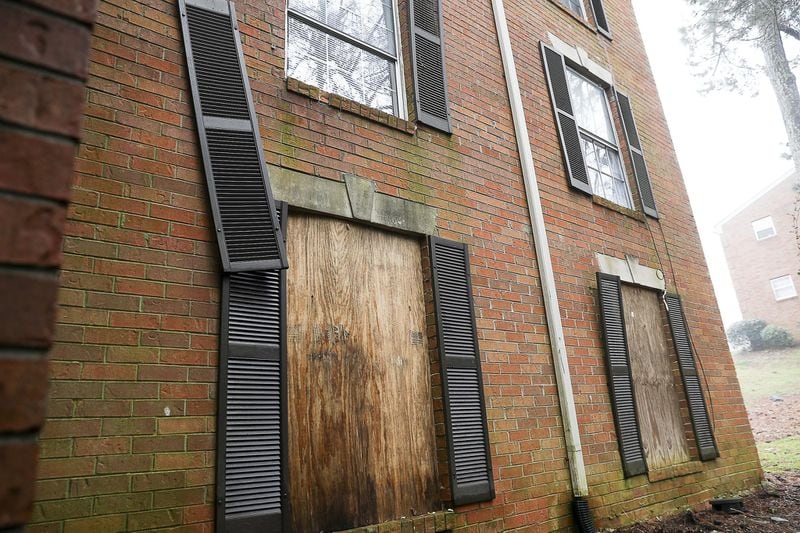 Apartment windows are boarded up at Parkview Apartments, located at 360 Riverside Parkway, in Austell, Thursday, February 21, 2019. ALYSSA POINTER/ALYSSA.POINTER@AJC.COM