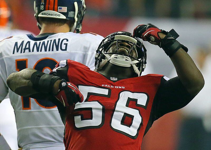 091712 ATLANTA: Atlanta Falcons linebacker Sean Weatherspoon pounds his chest in celebration after stopping Denver Broncos quarterback Peyton Manning on third down forcing a punt on the way to a 27-21 victory during second half action in their Monday Night Football game at the Georgia Dome in Atlanta on Monday, Sept. 17, 2012. CURTIS COMPTON / CCOMPTON@AJC.COM They aren't celebrating in Flowery Branch tonight. (Curtis Compton/AJC)