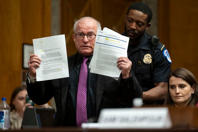 Daryl Guberman interrupts a Senate Homeland Security and Governmental Affairs - Subcommittee on Investigations hearing to examine Boeing's broken safety culture to announce he has information about Boeing to share with the committee on Wednesday, April 17, 2024, in Washington. (AP Photo/Kevin Wolf)