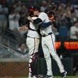 Braves pitcher Max Fried (right) is congratulated by catcher Travis d'Arnaud after throwing a complete-game shutout at Truist Park in Atlanta on Tuesday, April 23, 2024. The Braves won 5-0 over the Miami Marlins. (Hyosub Shin / AJC)