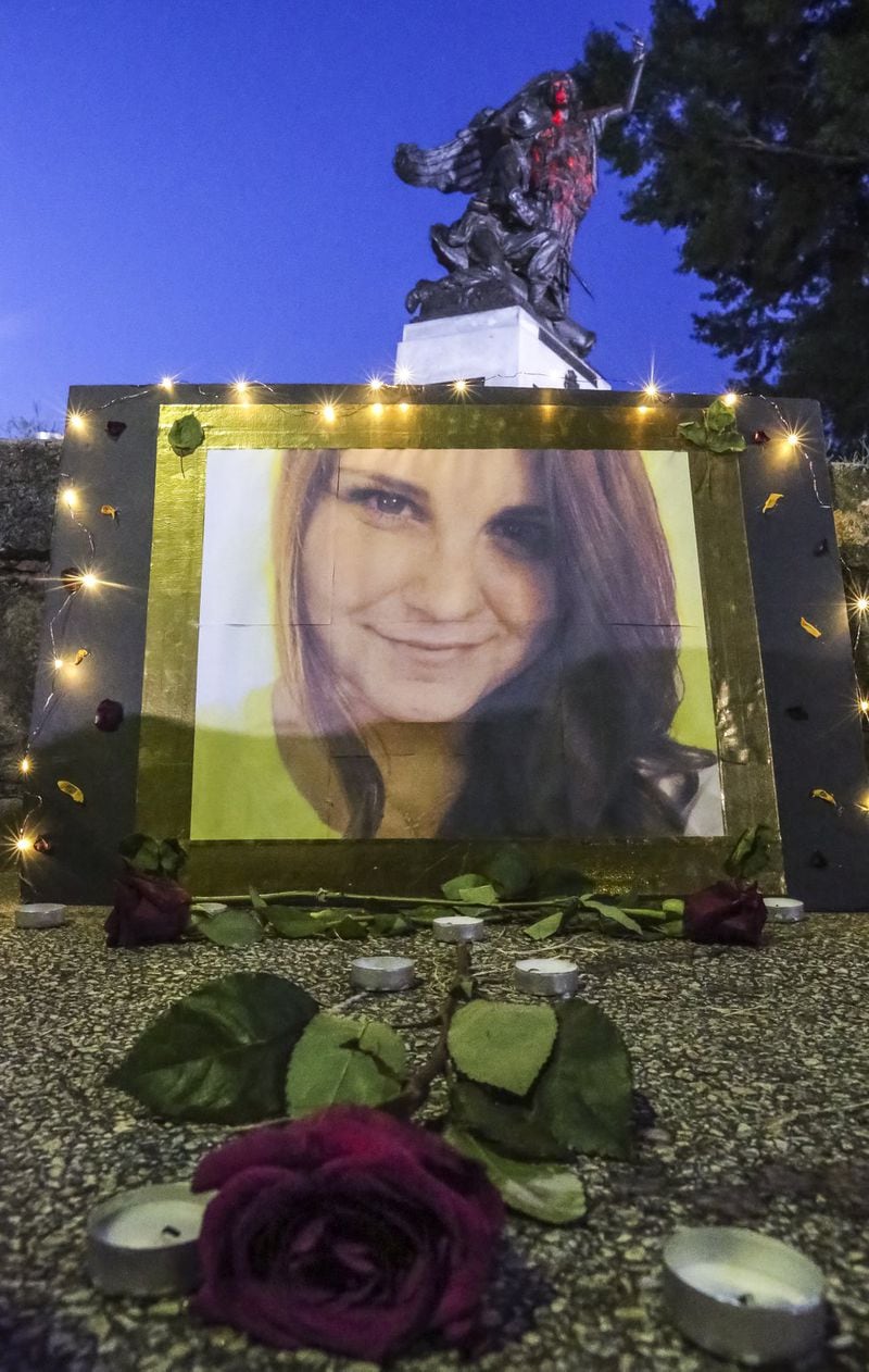 A lit memorial of Heather Heyer — a counterprotester who was killed in white supremacist violence in Charlottesville, Va. — sits near the Peace Monument in Piedmont Park in Atlanta on Monday, Aug. 14, 2017, after the Peace Monument was defaced overnight Sunday by protesters angry over Charlottesville. JOHN SPINK/JSPINK@AJC.COM