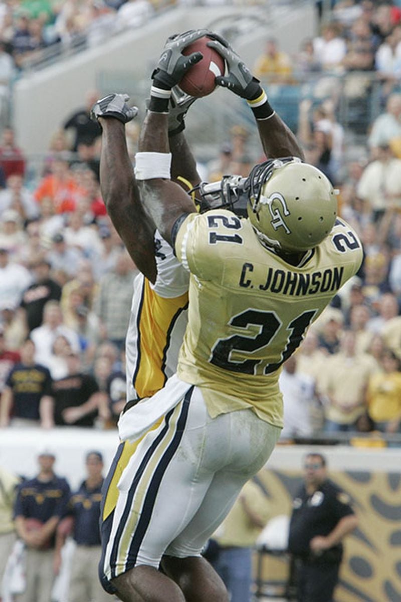 Georgia Tech wide receiver Calvin Johnson (21) goes high to make this touchdown catch against West Virginia in the 2007 Gator Bowl.