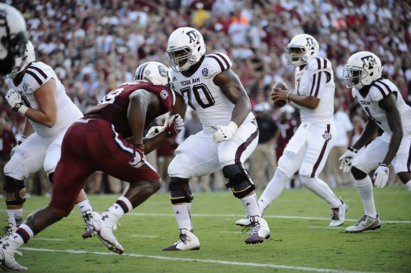 Texas A&amp;M offensive linesman Cedric Ogbuehi (70) guards against South Carolina during the first half of an NCAA college football game on Thursday, Aug. 28, 2014, in Columbia, S.C. Texas A&amp;M won 52-28. (AP Photo/Rainier Ehrhardt) I'm guessing this pass was completed. (Rainier Erhardt/AP)