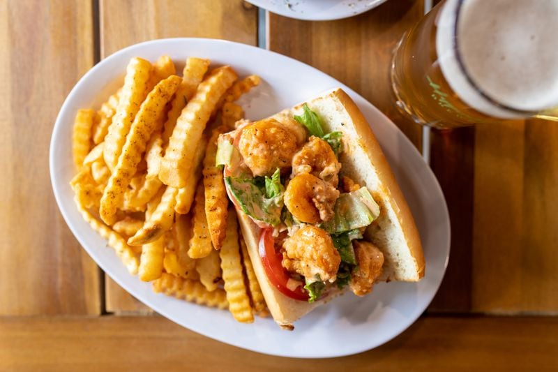 Hippin Hops Brewery's Shrimp Po'Boy served in a 6-inch French bread roll with lettuce and tomatoes, topped with Hippin Hops' Hippin remoulade sauce. (Mia Yakel for The Atlanta Journal-Constitution)