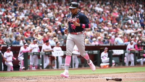 Braves third baseman Johan Camargo scores a run on a single hit by Ender Inciarte during the second inning against the Arizona Diamondbacks Sunday, May 12, 2019, at Chase Field in Phoenix.