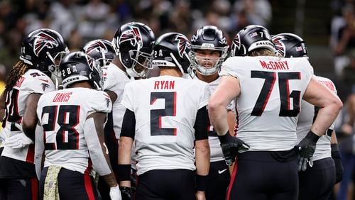 Atlanta Falcons quarterback Matt Ryan (2) huddles with the team during the first half of an NFL football game against the New Orleans Saints, Sunday, Nov. 7, 2021, in New Orleans. (AP Photo/Butch Dill)