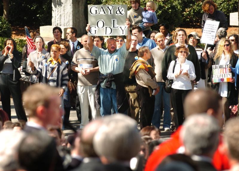 In this 2004 file photo, a large crowd protests the state constitutional amendment that would ban gay marriage in Georgia. Supporters of the amendment are in the foreground.