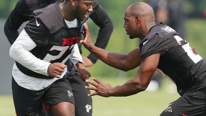 073021 Flowery Branch: Atlanta Falcons safeties Richie Grant (left) and Duron Harmon (right) get in some extra work after the second day of training camp practice at the team training facility on Friday, July 30, 2021, in Flowery Branch.   “Curtis Compton / Curtis.Compton@ajc.com”