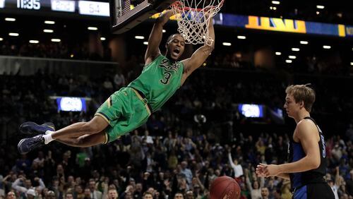 Notre Dame forward V.J. Beachem (3) dunks the ball against Duke Blue guard Luke Kennard (5) in the second half of an NCAA college basketball game during the championship game of the Atlantic Coast Conference tournament, Saturday, March 11, 2017, in New York. Duke won 75-69. (AP Photo/Julie Jacobson)