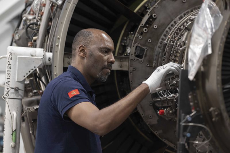A worker repairs aircraft parts inside Safran Aircraft Engines repair plant outside of Casablanca, Morocco, Thursday, April 18, 2024. Moroccan officials are aiming to turn the country into an aerospace hub, luring investors and manufacturers who have aimed to spread out their supply chains and find willing workers since the COVID-19 pandemic. (AP Photo)