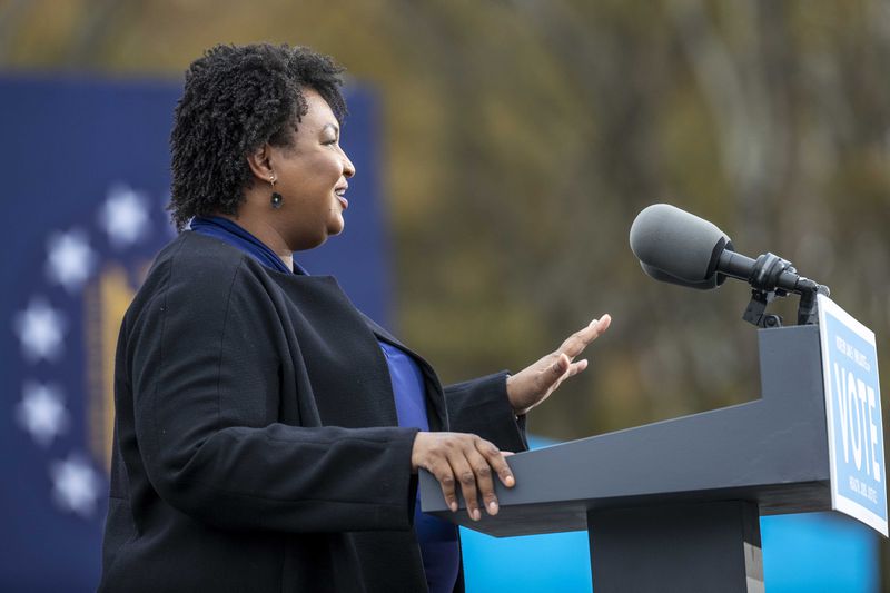 Democrat Stacey Abrams will stay out of the way right now as Republicans fight over whether to back Gov. Brian Kemp for reelection or support former President Donald Trump's choice in the race, former U.S. Sen. David Perdue. Abrams will look to turn the rift into a gift in November. (Alyssa Pointer / Alyssa.Pointer@ajc.com)