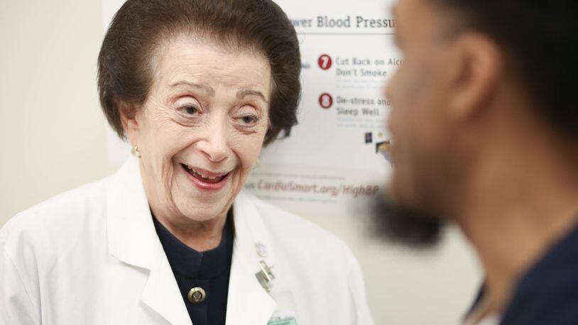 Dr. Nanette Wenger, a cardiologist, talks with patient Michael Daniels at Grady Hospital Wednesday. PHOTO / JASON GETZ
