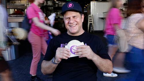 Umami Burger founder Adam Fleischman, with a peanut butter and jelly sandwich, at Grand Central Market in Los Angeles, Calif. (Christian K. Lee/Los Angeles Times/TNS)