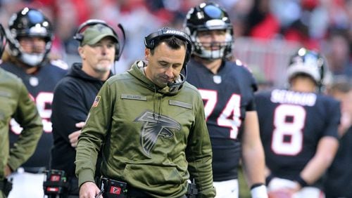 Atlanta Falcons offensive coordinator Steve Sarkisian, head coach Dan Quinn, and players react in the final minutes of a 22-19 loss to the Dallas Cowboys in a NFL football game on Sunday, Nov. 18, 2018, in Atlanta.  Curtis Compton/ccompton@ajc.com