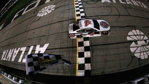 With no other car in sight, Kevin Harvick crosses the finish line in Sunday's Folds of Honor QuikTrip 500. (Daniel Shirey/Getty Images)
