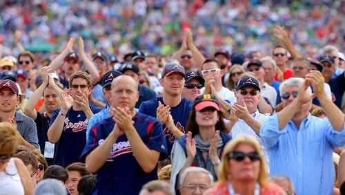 Braves fans cheer on during induction ceremonies at the Hall of Fame in Cooperstown, N.Y.